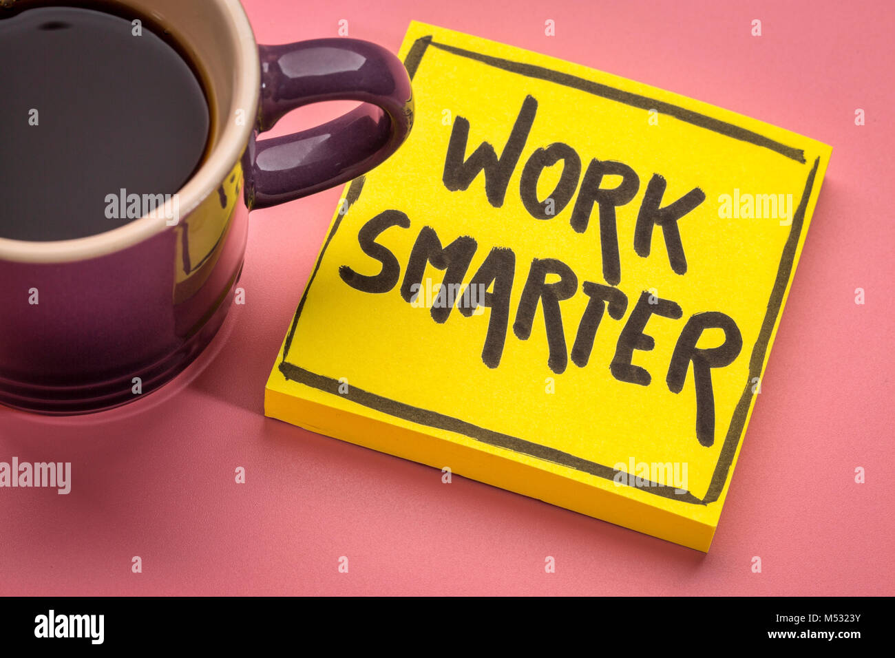 work smarter inspirational advice or reminder - handwriting on a sticky note with a cup of coffee Stock Photo