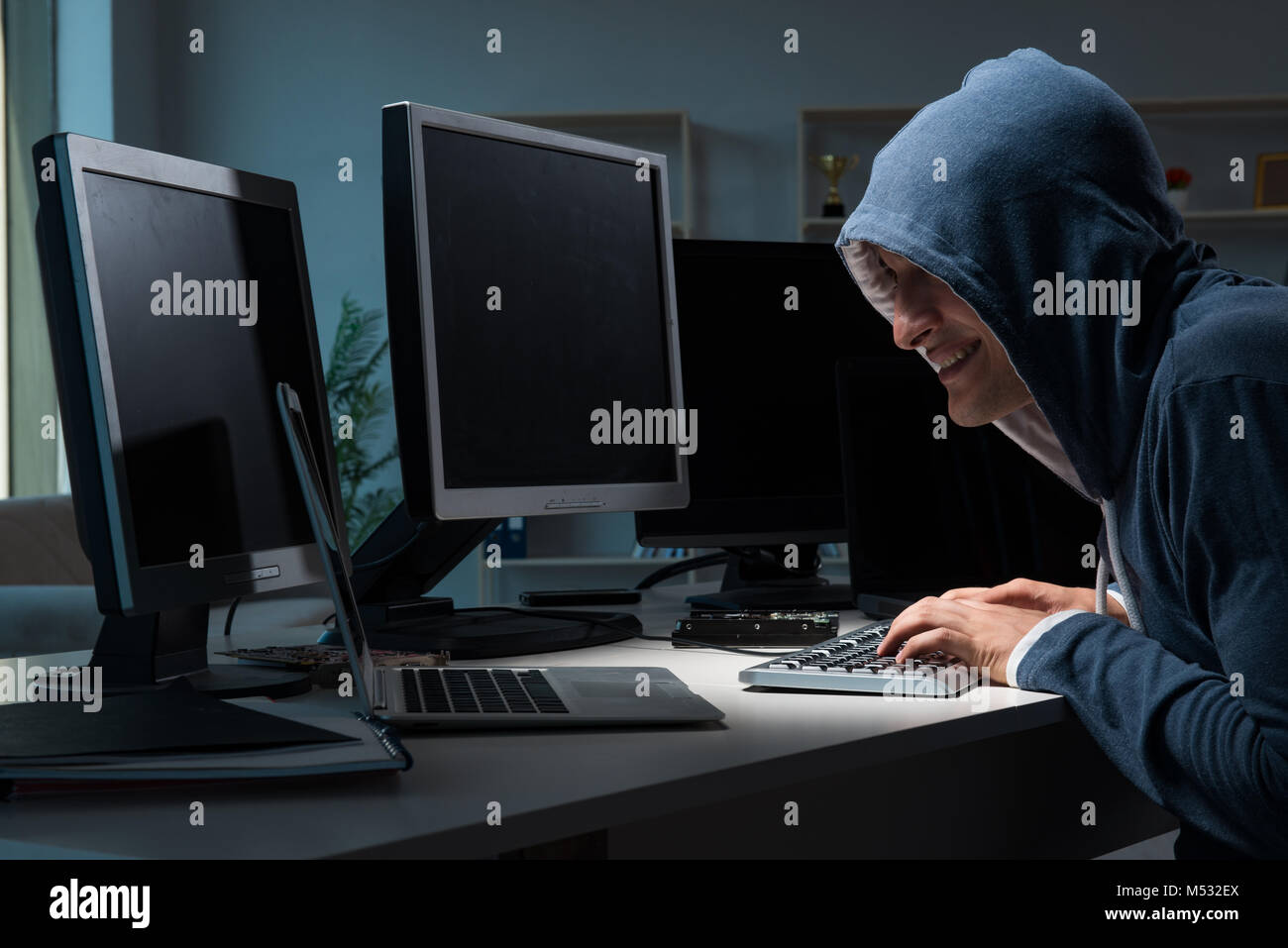 Hacker hacking computer at night Stock Photo - Alamy