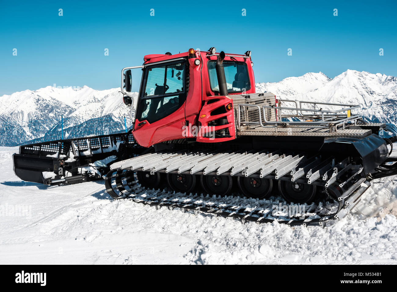 Snow grooming machine (Ratrak). Winter mountain landscape Stock Photo