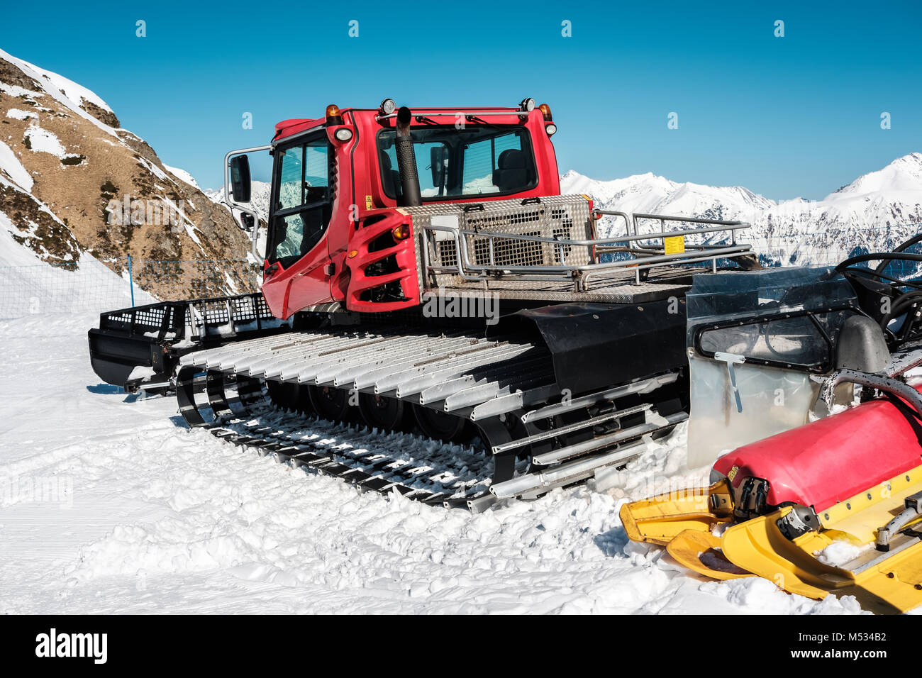 Snow grooming machine (Ratrak). Winter mountain landscape Stock Photo