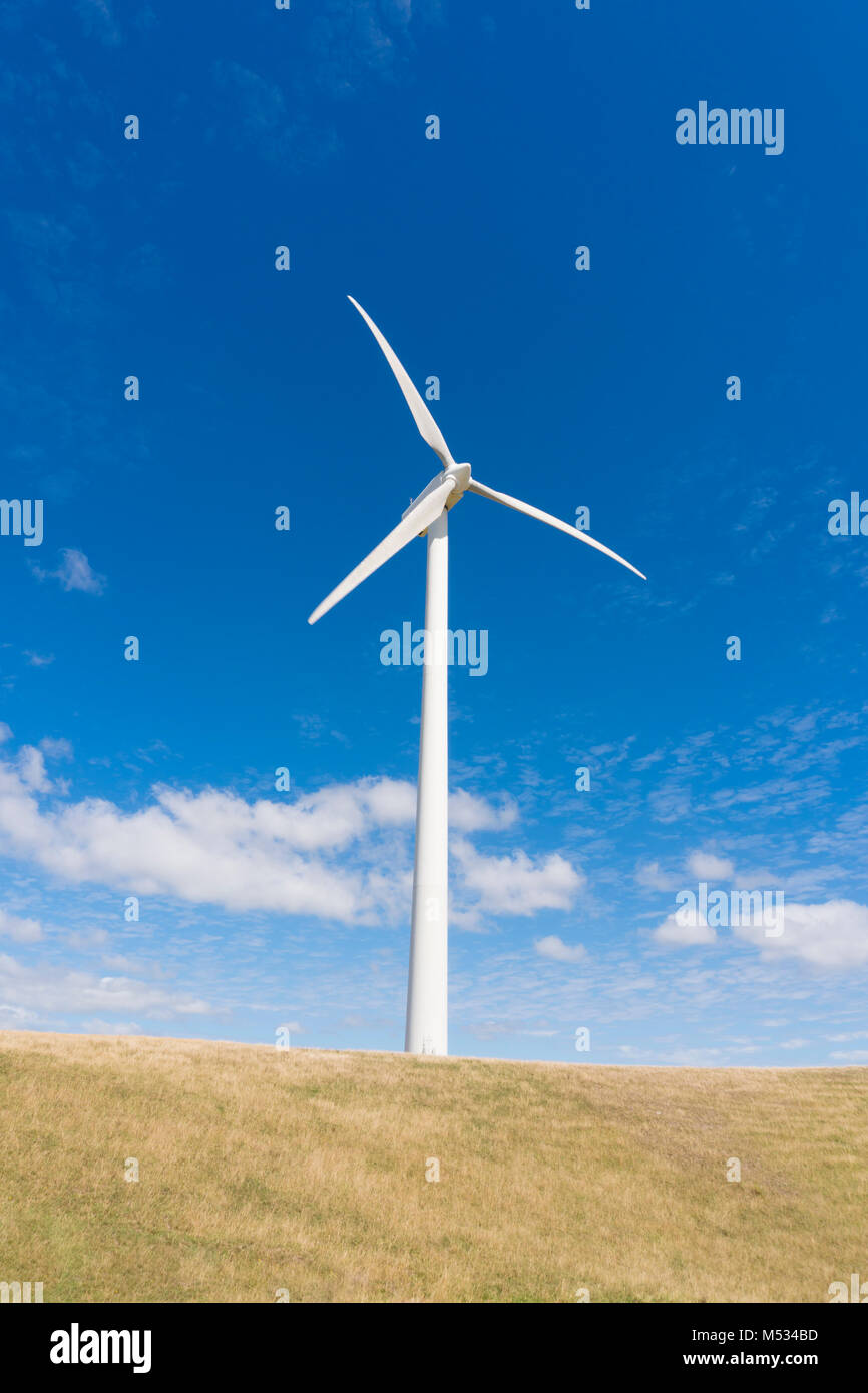 Wind turbine against clear blue sky Stock Photo - Alamy