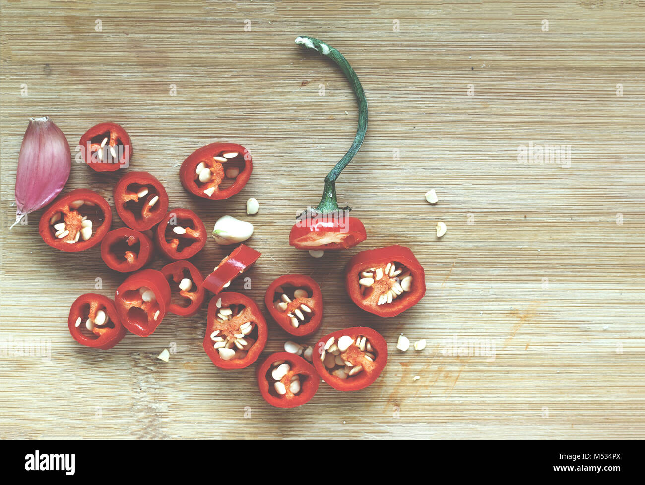 Hot chili pepper chopped on a cutting board Stock Photo - Alamy