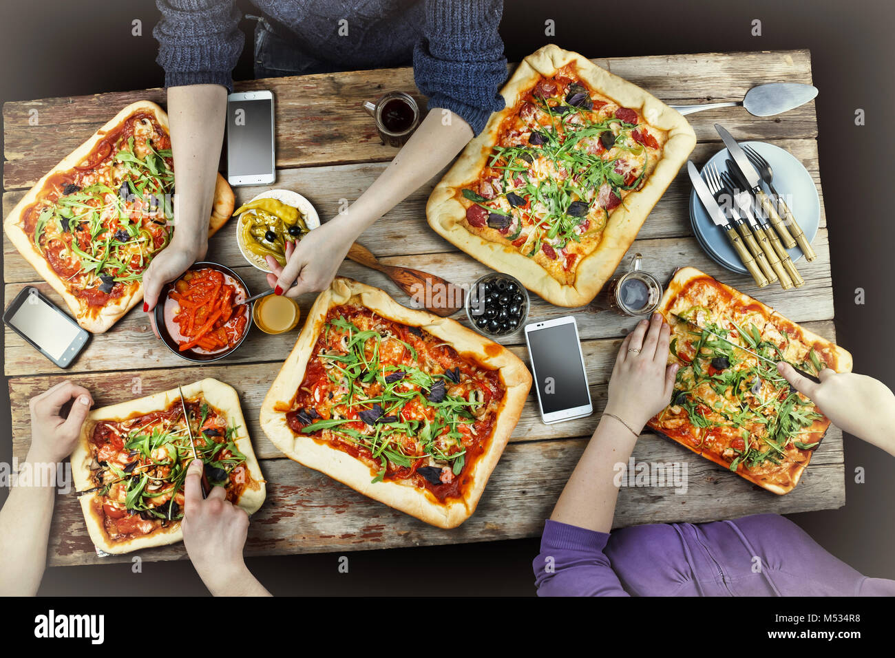 Cutting pizza. Domestic food and homemade pizza Stock Photo Alamy