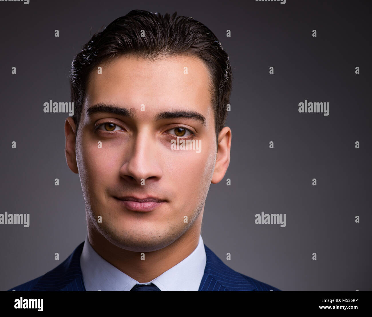 Portrait of young handsome businessman Stock Photo - Alamy