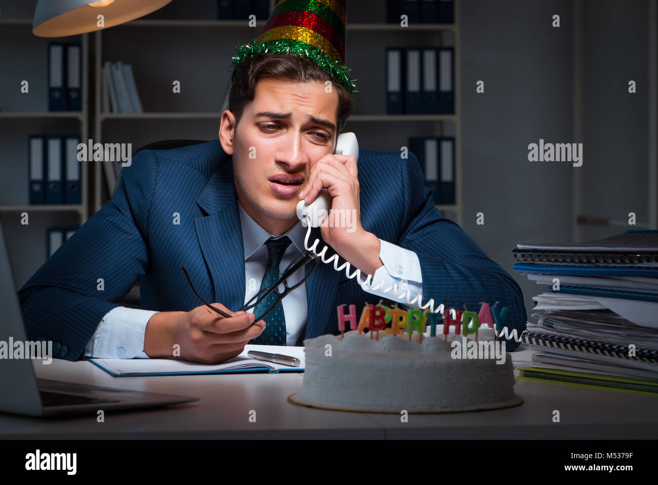 Man celebrating birthday in the office Stock Photo