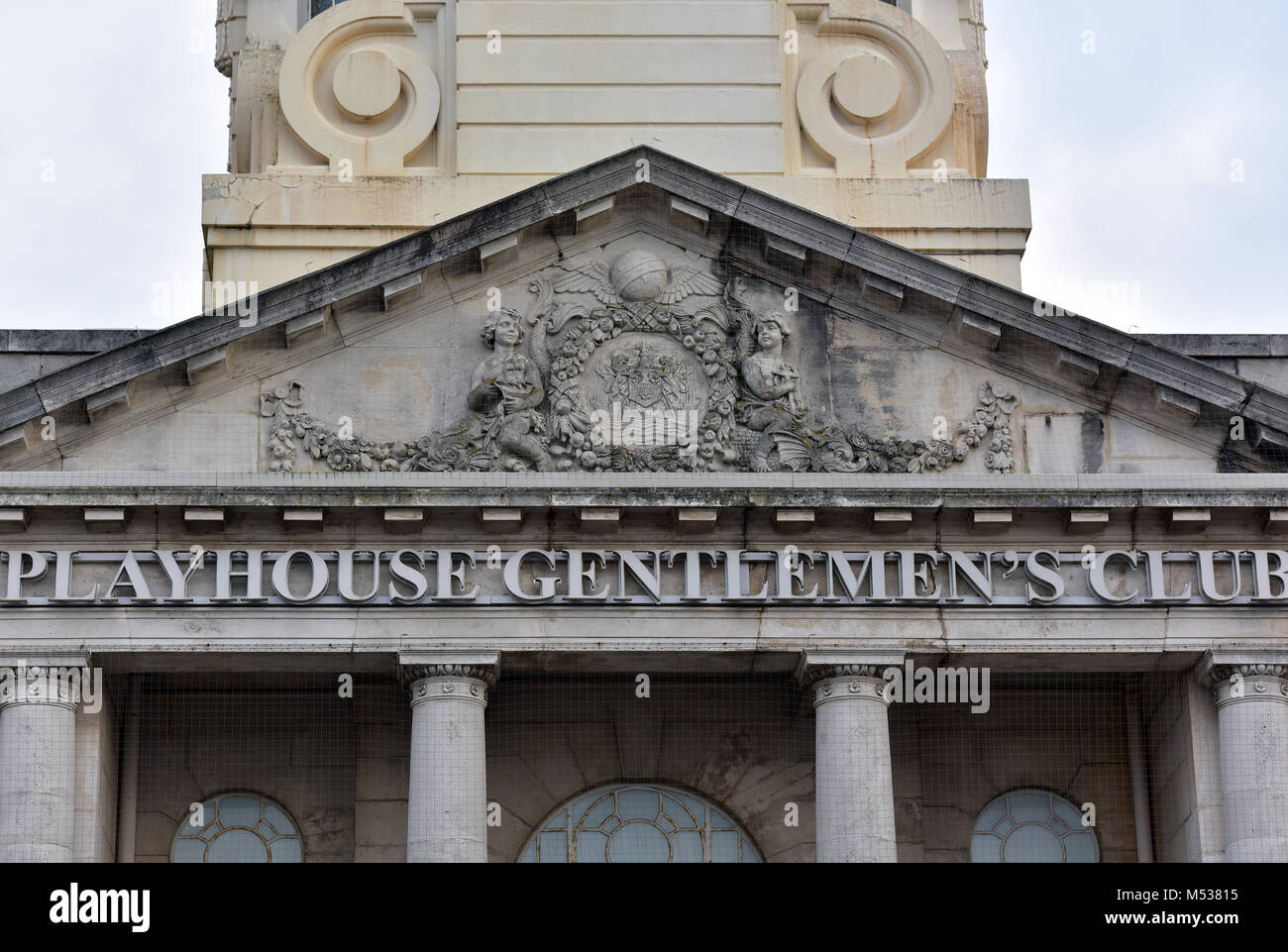 the ornate stonework and facade to a gentlemans playhouse club