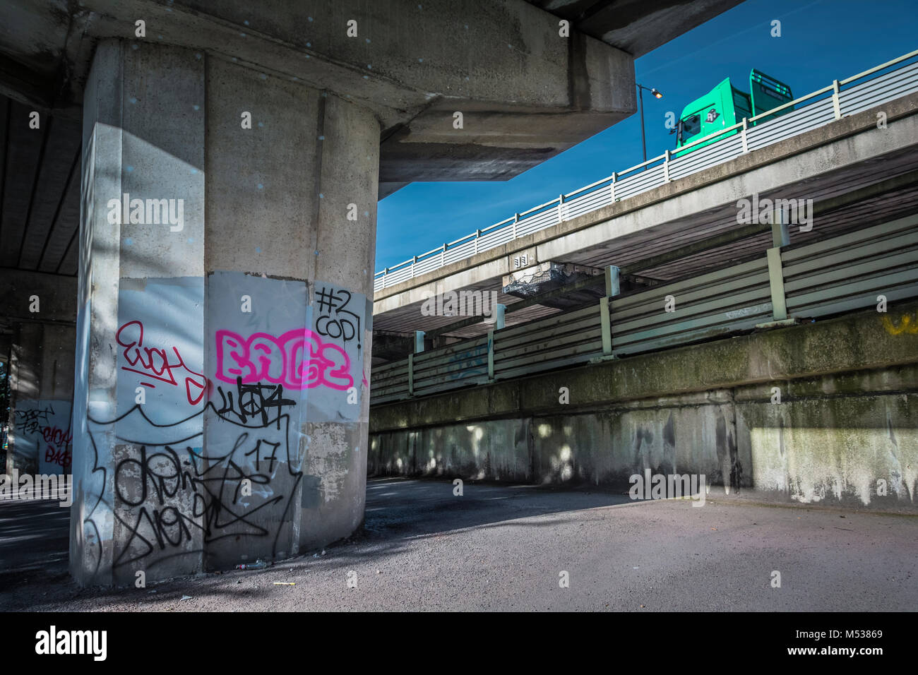 Concrete pillars and graffiti below the A4/M4 Chiswick Flyover in west London, England, UK Stock Photo