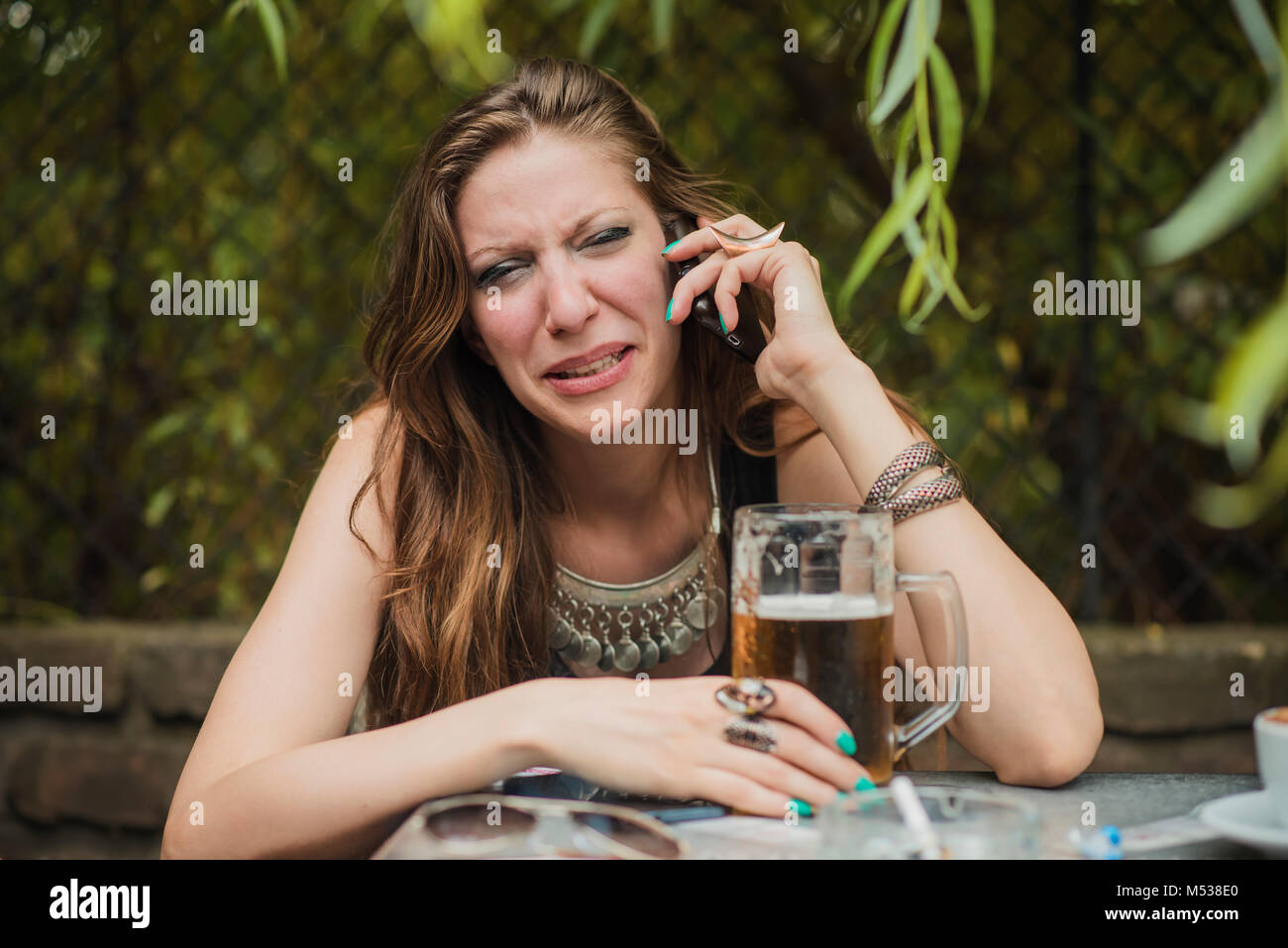 Woman breaking up over her cell phone Stock Photo Alamy