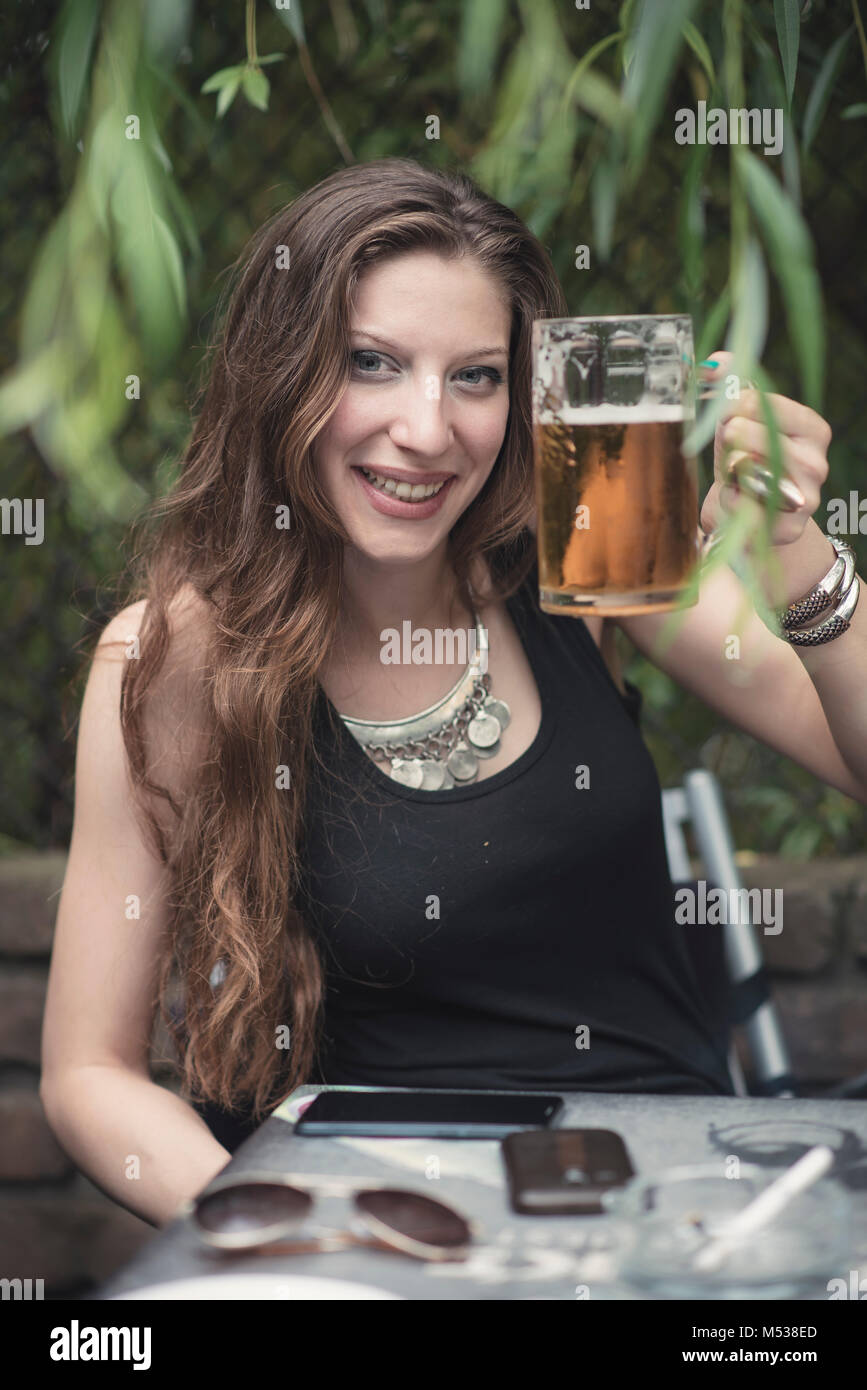 Young woman making a toast Stock Photo