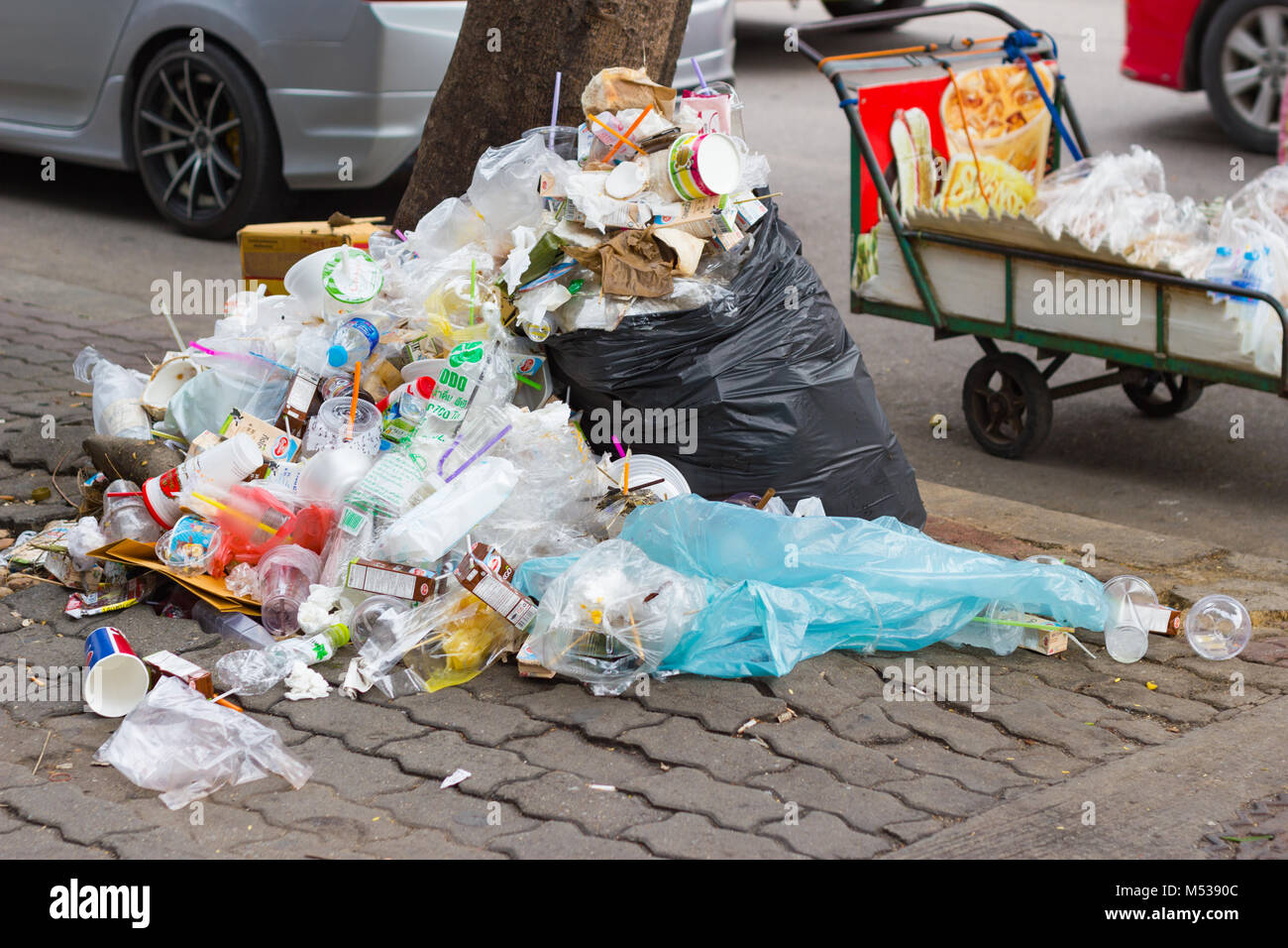 Bangkok province, Thailand:- January 8, 2018:- The streets of Bangkok Piles of garbage dumped along the road. Stock Photo