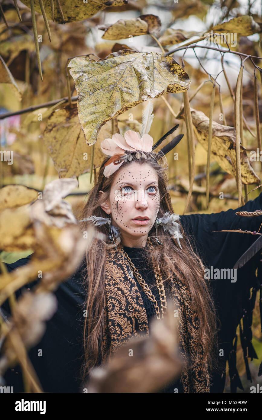 Shaman tribal woman casting ritual magic in nature Stock Photo - Alamy