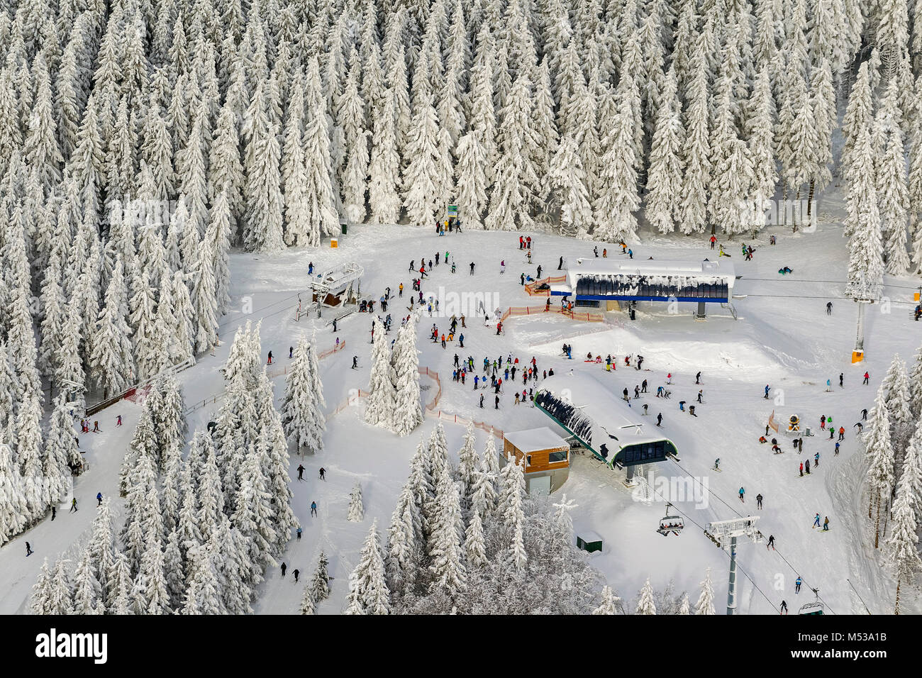 Aerial view, top station of the ski lift, snow, ski lift, snakes in front of the ski lift, winter in Winterberg, Winterberg, Sauerland, Hochsauerlandk Stock Photo