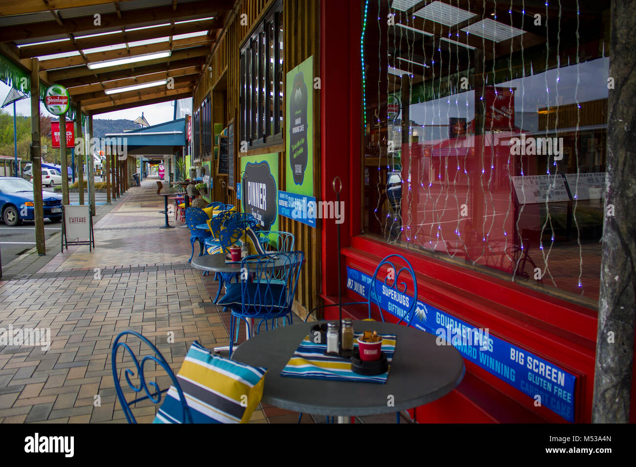Coffee terrace with Christmas lights in the window, New Zealand Stock