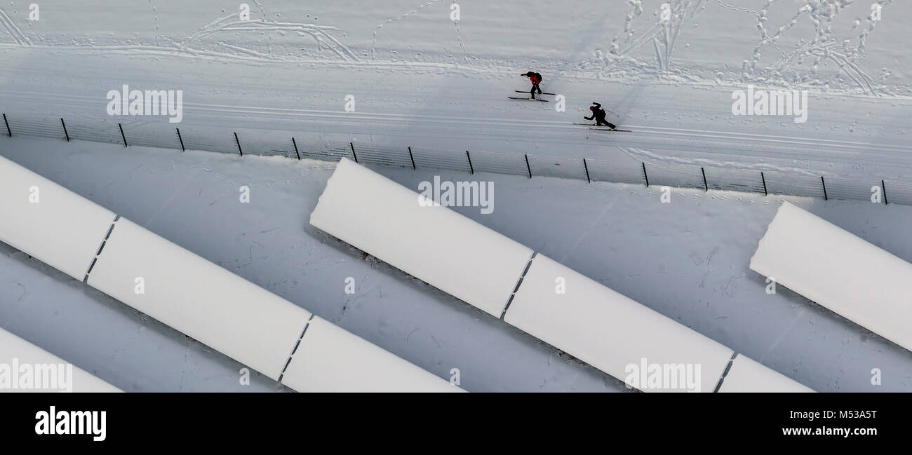 Aerial view, cross-country skiers beside a snow-covered solar system, snow, winter in winter mountain, winter mountain, Sauerland, Hochsauerlandkreis, Stock Photo