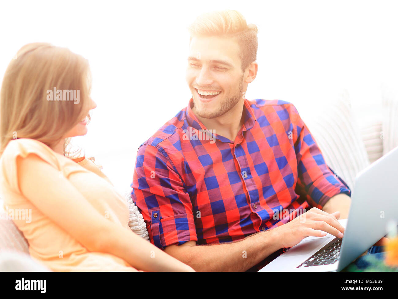 closeup of a smiling young couple with laptop Stock Photo - Alamy