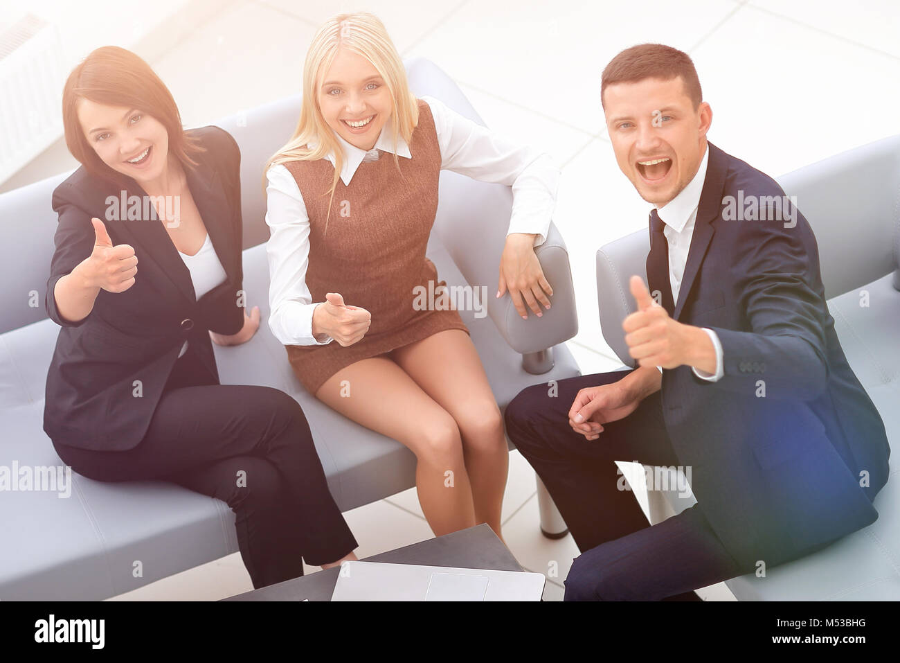 successful business team sitting in the lobby of the office Stock Photo ...