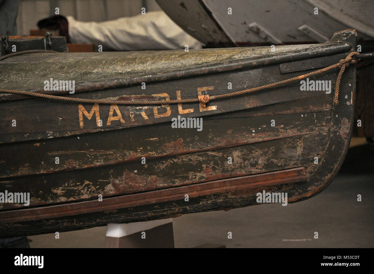 Grand Canyon History Symposium Historic Boat Tour . View of the historic wooden boat, the Marble, in the museum collection storage area. [Brown worn wooden starboard side with name painted in white capital lettering.]  The Grand Canyon Historical Society [GCHS] held the 4th Grand Canyon History Symposium on the  South Rim, Grand Canyon National Park, on November 4-6, 2016.  As one of the many events and presentations held during the 4th Grand Cany Stock Photo