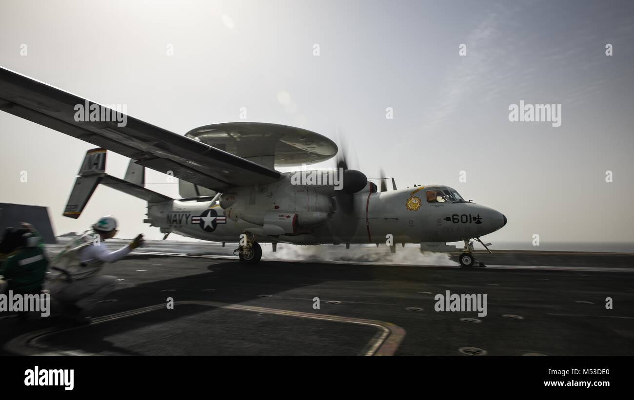 180219-N-VN584-1660 ARABIAN GULF (Feb. 19, 2018) An E-2C Hawkeye, assigned to the Sunkings of Carrier Airborne Early Warning Squadron (VAW) 116, launches from the flight deck of the aircraft carrier USS Theodore Roosevelt (CVN 71). Theodore Roosevelt and its carrier strike group are deployed to the U.S. 5th Fleet area of operations in support of maritime security operations to reassure allies and partners and preserve the freedom of navigation and the free flow of commerce in the region. (U.S. Navy photo by Mass Communication Specialist 3rd Class Alex Corona/Released) Stock Photo