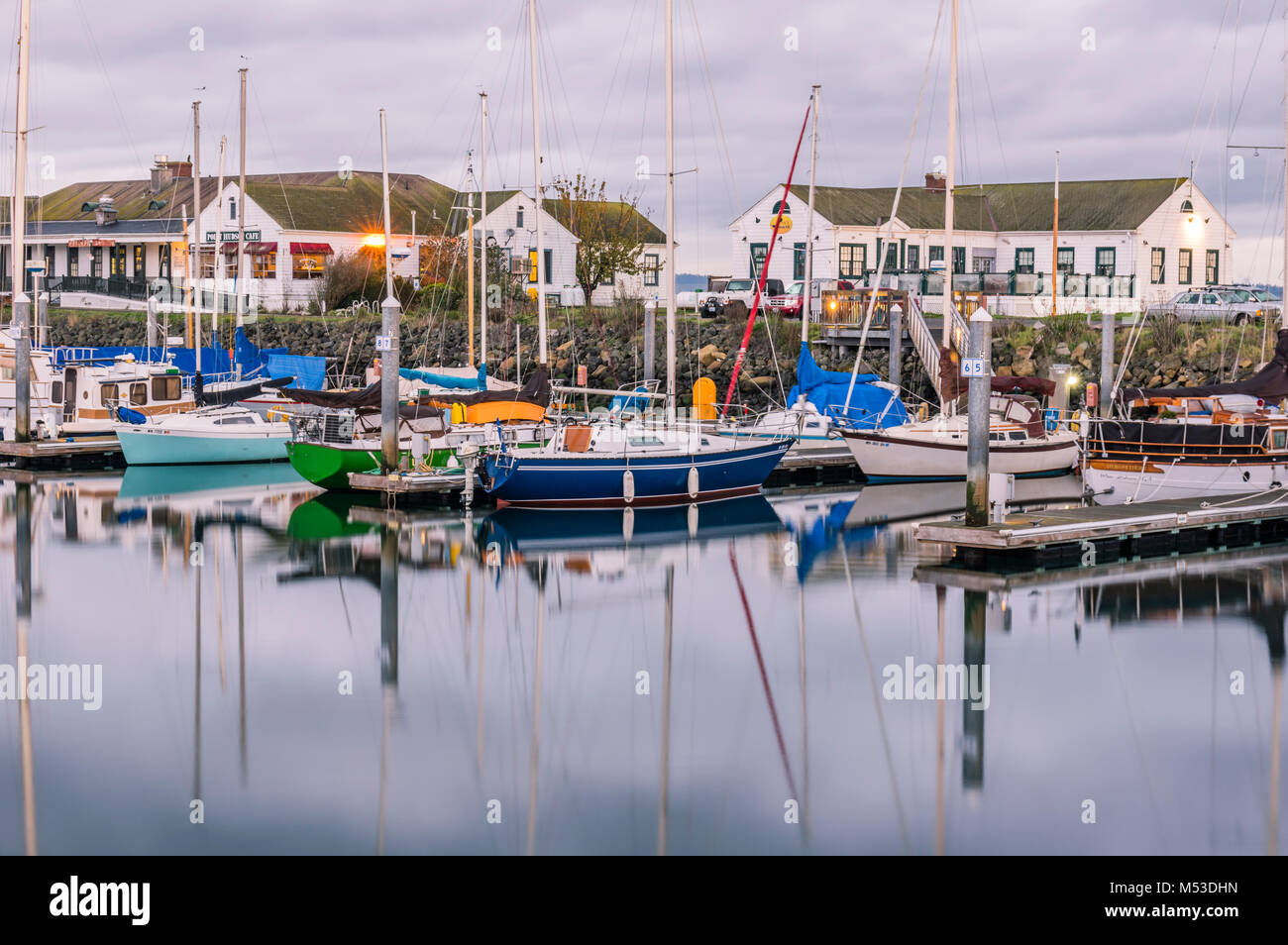 Boats of all types moored in the harbor at dawn.  Port Townsend, Washington Stock Photo