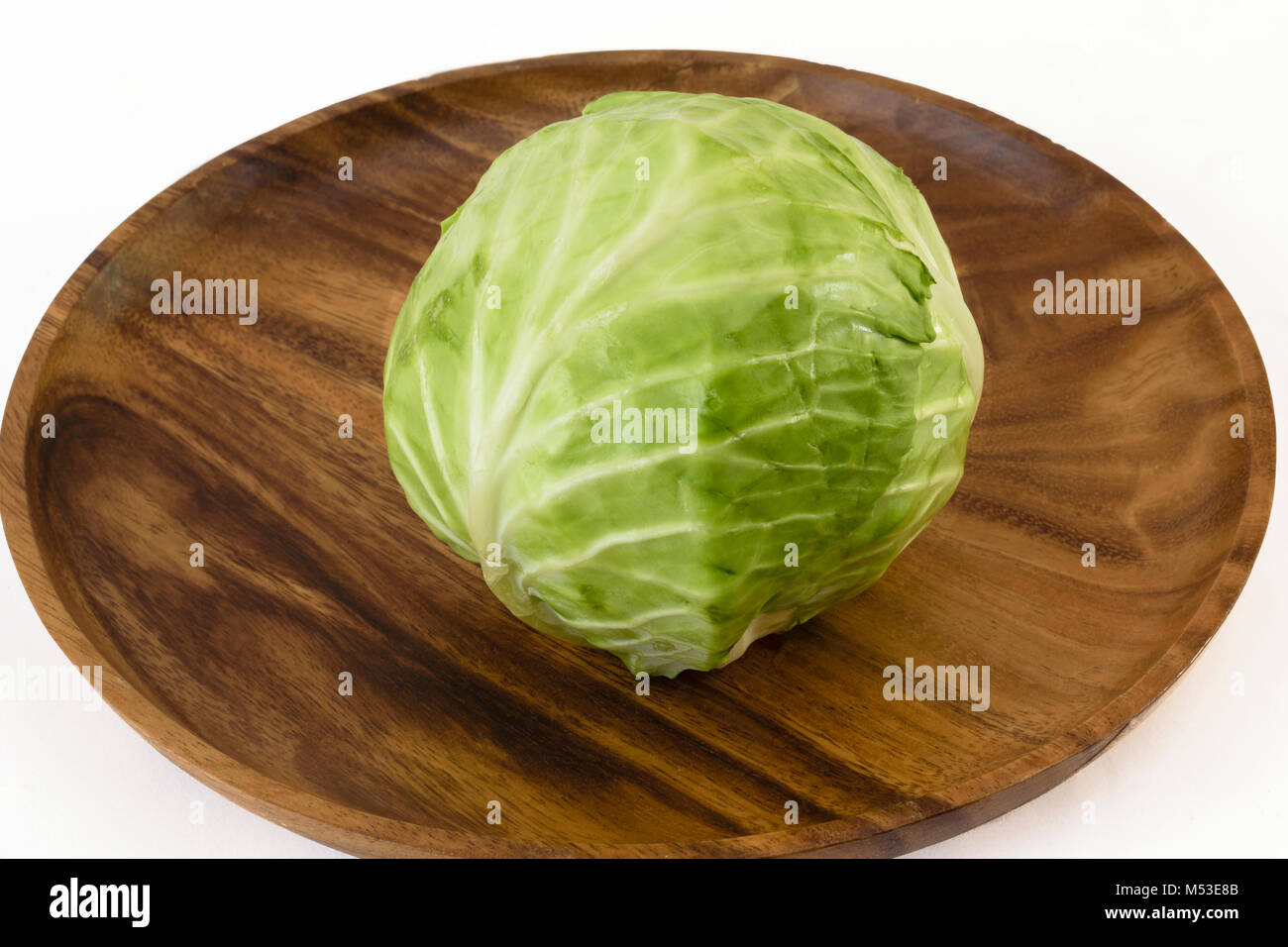 Sigle raw cabbageon a wooden dish Stock Photo