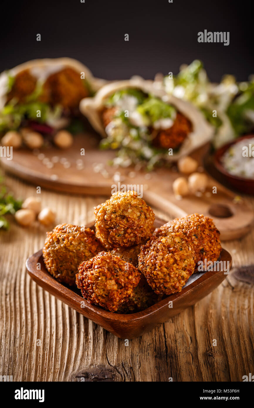 Fresh chickpeas falafel balls in wooden bowl Stock Photo