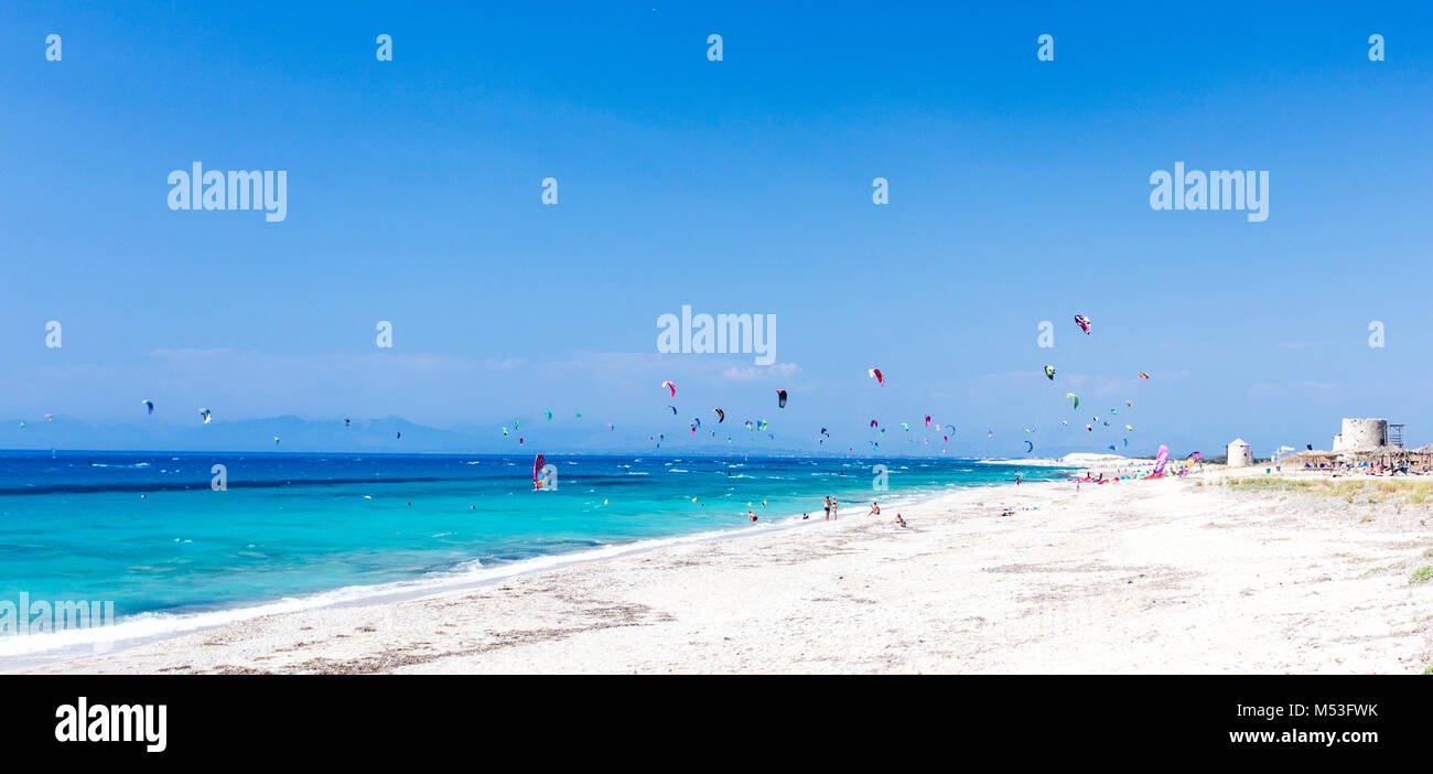Wind and kite surfing at the turquoise waters of Agios Ioannis Surf Beach at Lefkada, Greece, located at the Ionian coast. Stock Photo