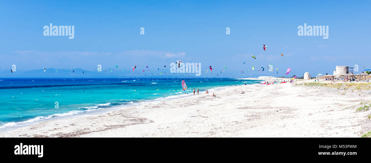 Wind and kite surfing at the turquoise waters of Agios Ioannis Surf Beach at Lefkada, Greece, located at the Ionian coast. Stock Photo
