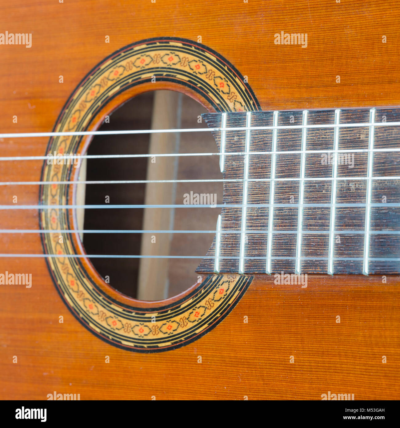 closeup of hole in spanish classical guitar Stock Photo - Alamy
