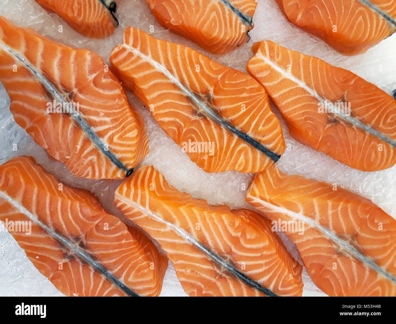 Fresh raw salmon steaks on ice at the market Stock Photo - Alamy