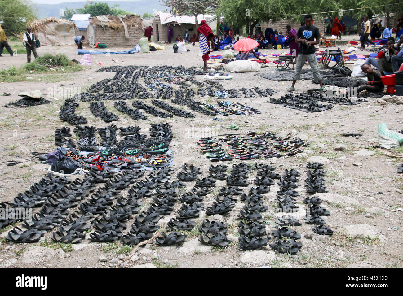 Africa, Tanzania, Frontier Market selling shoes from old tires The goods are placed on a blanket on the ground Stock Photo