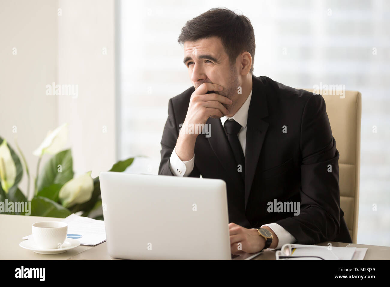 Company manager feeling sleepy at workplace Stock Photo