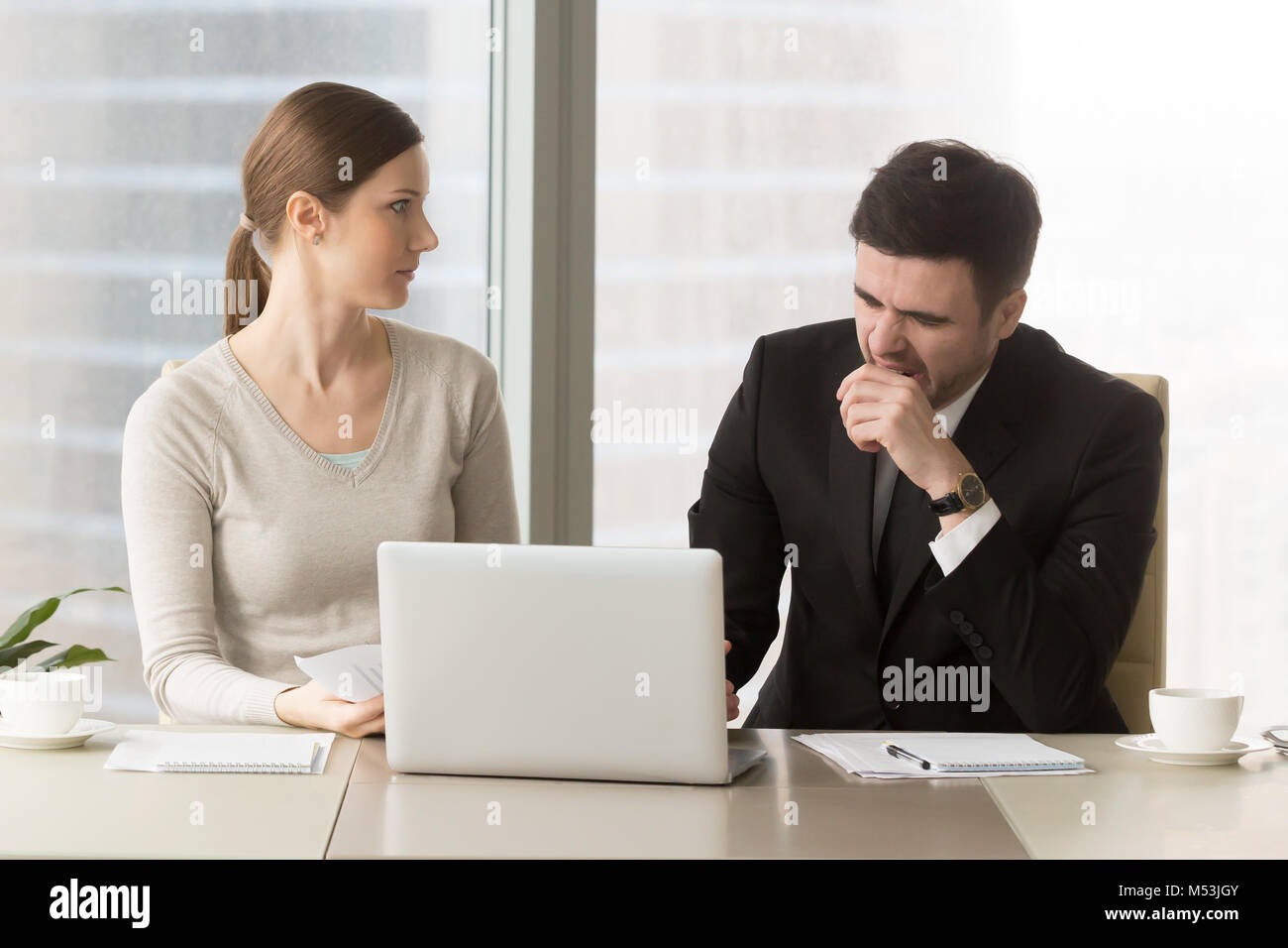Businessman yawning on boring business meeting Stock Photo
