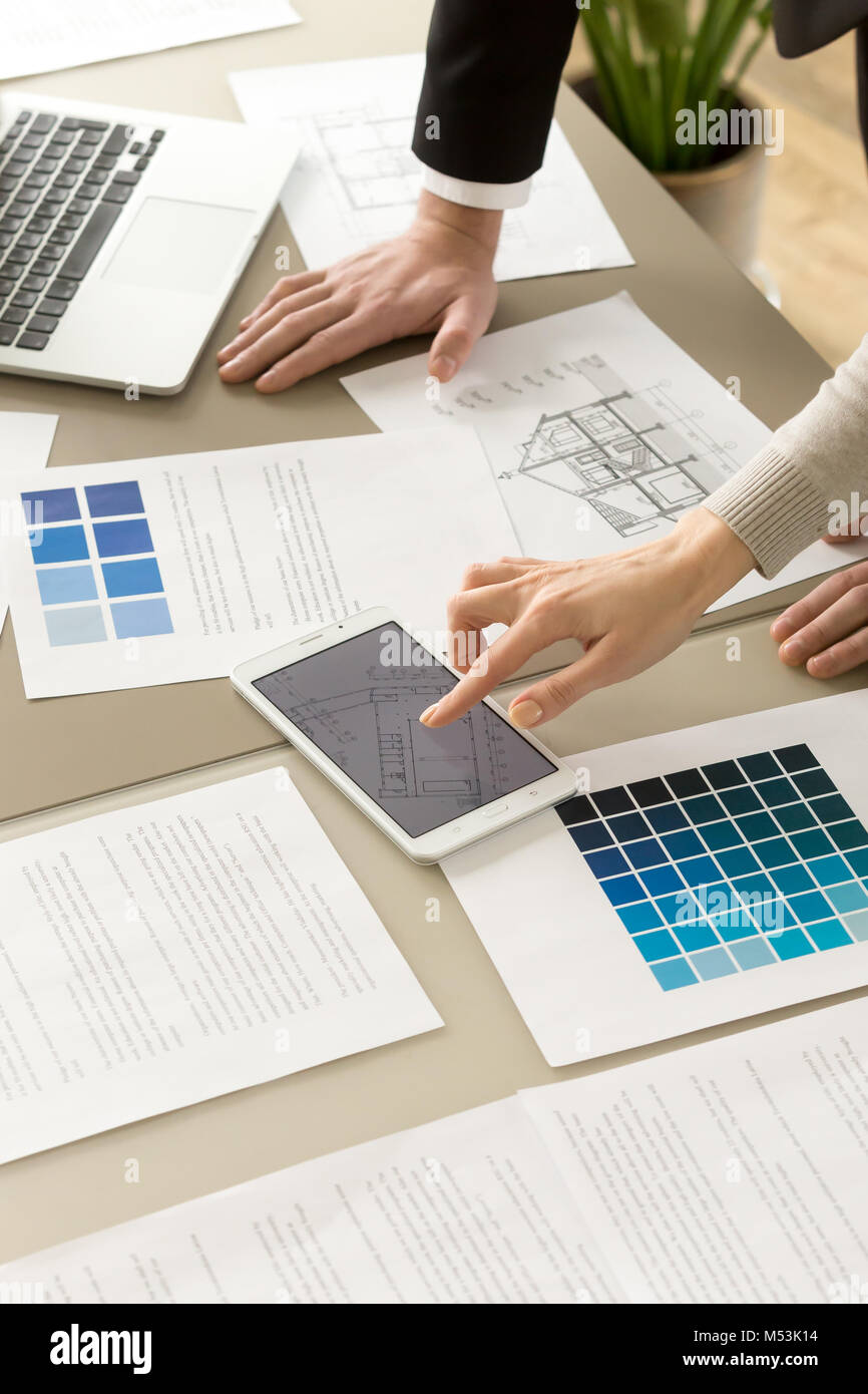 Architects colleagues working together on project Stock Photo