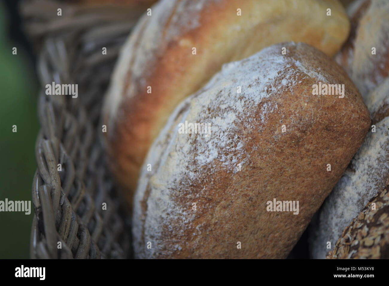 loaves of fresh baked artisan bread in a basket Stock Photo Alamy