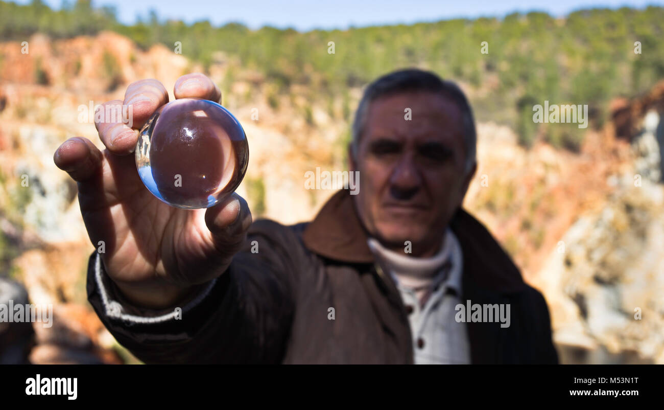 Elderly man and crystal ball. Stock Photo