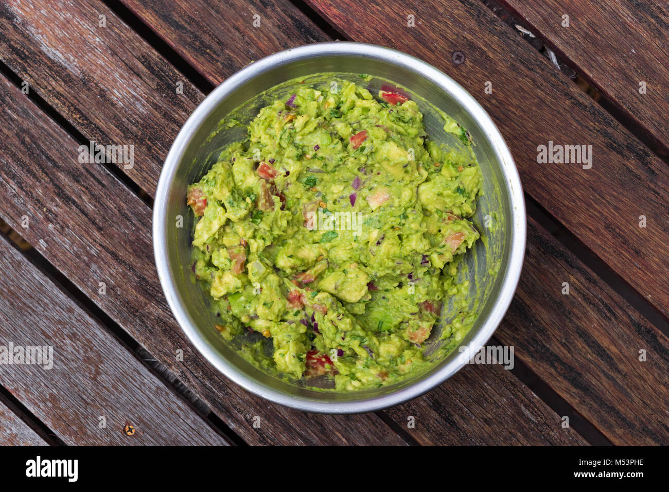 Making a big bowl of avocado guacamole Stock Photo - Alamy