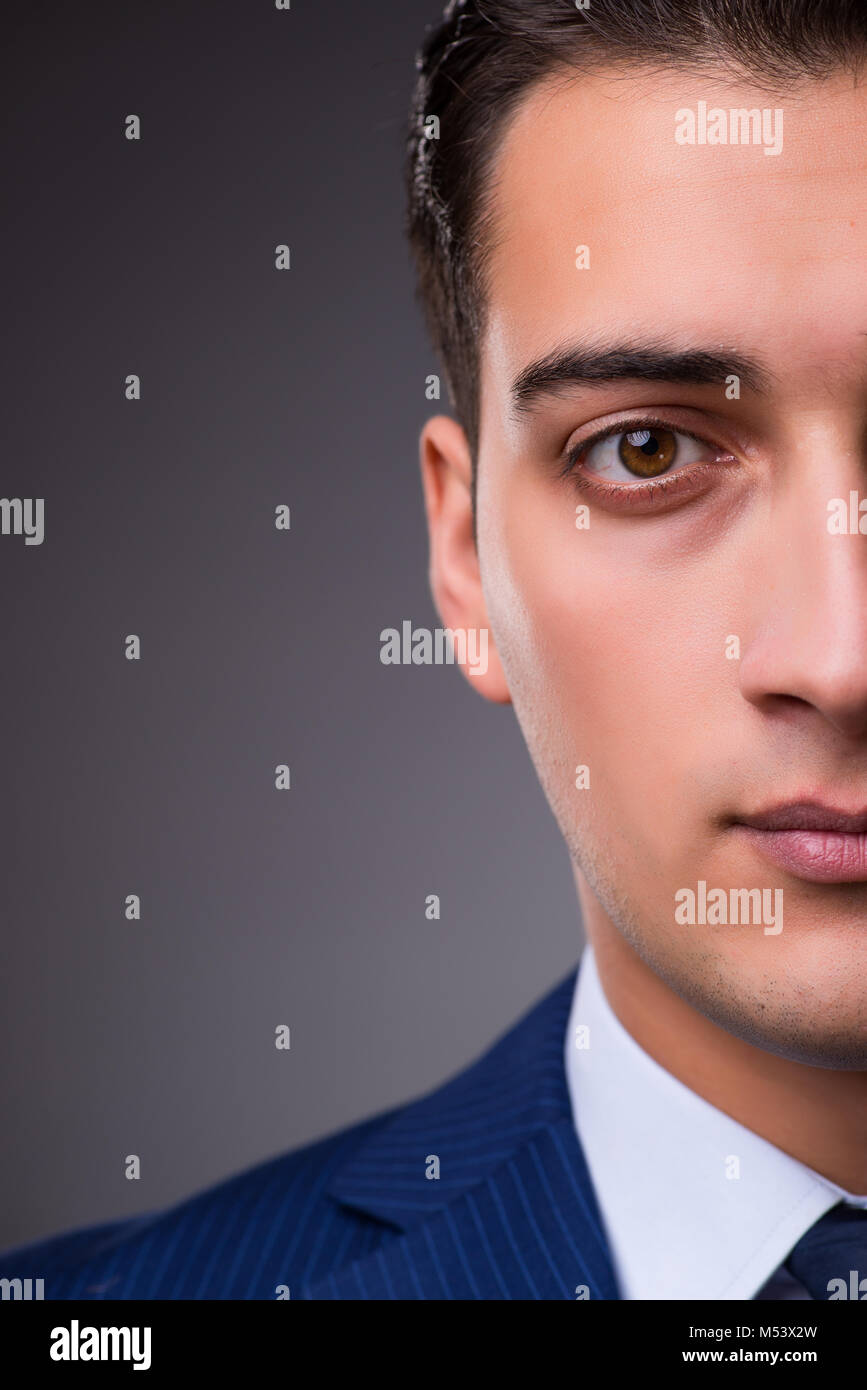Portrait of young handsome businessman Stock Photo - Alamy