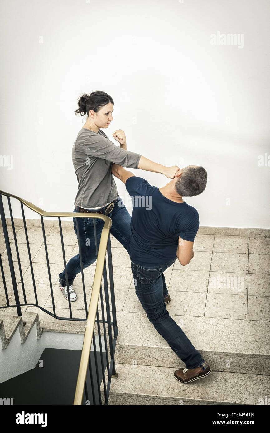 young woman fighting with man Stock Photo
