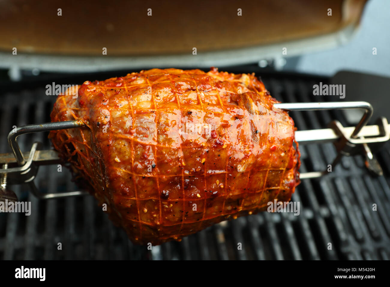 a roll roast on a spit Stock Photo