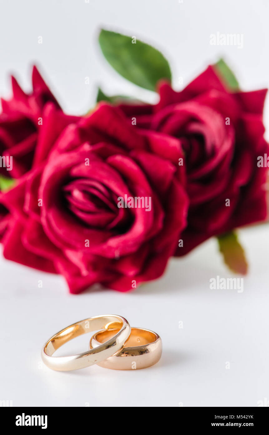 Wedding concept with rings and roses Stock Photo - Alamy