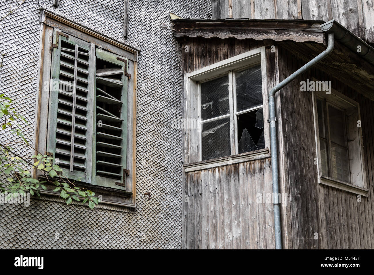 Window at an abandoned residential and farmhouse - Lost Place Stock Photo