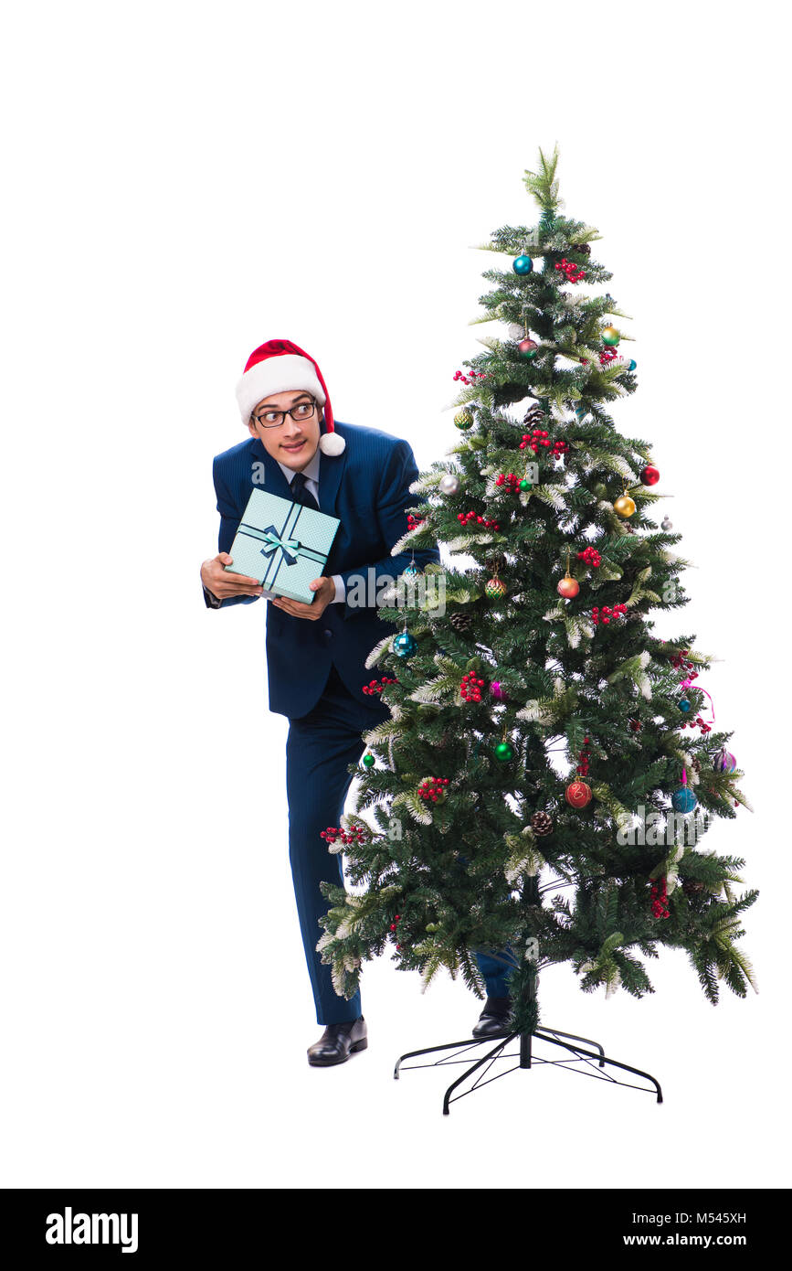 Businessman decorating christmas tree isolated on white Stock Photo