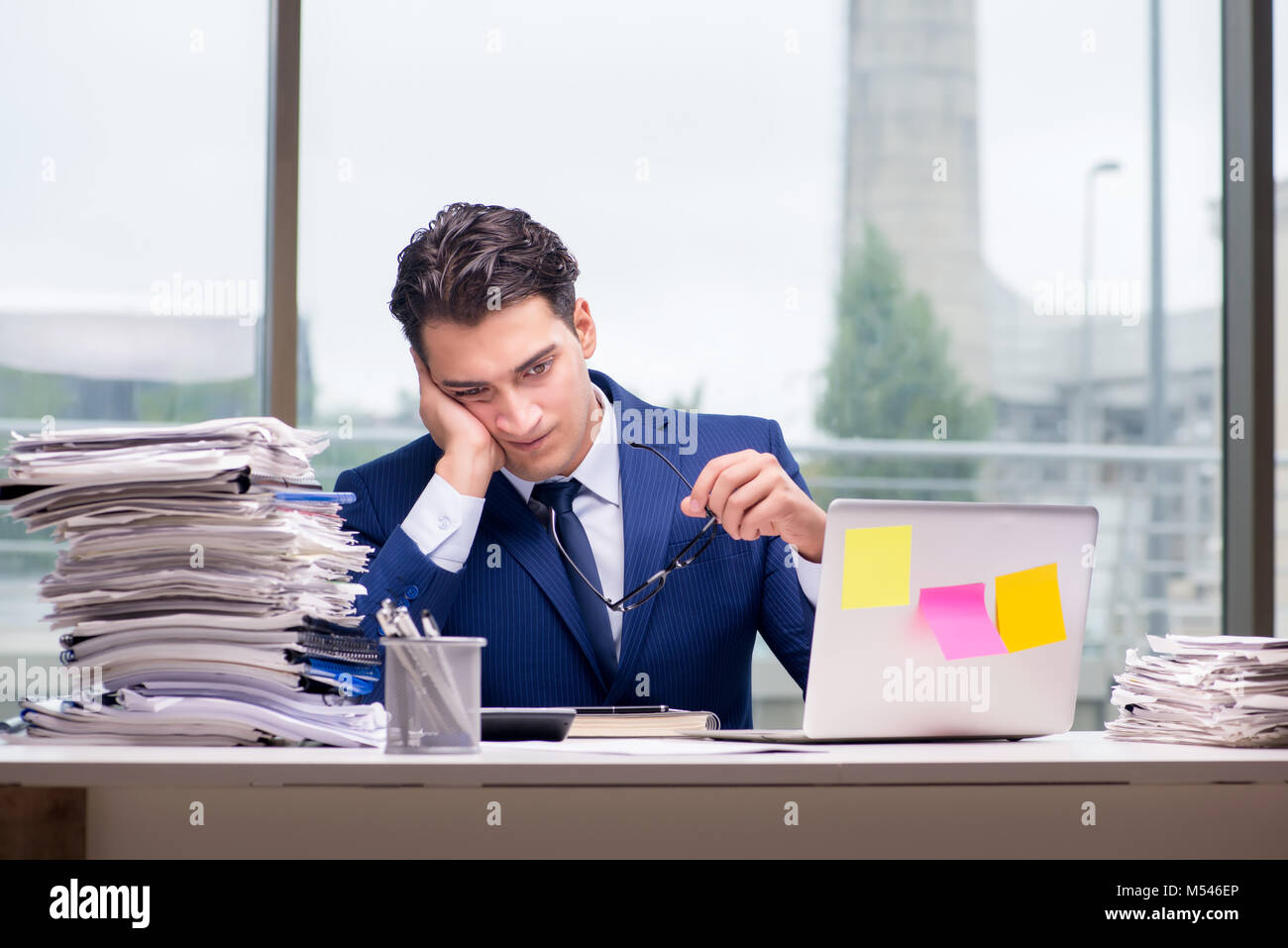 Workaholic businessman overworked with too much work in office Stock ...