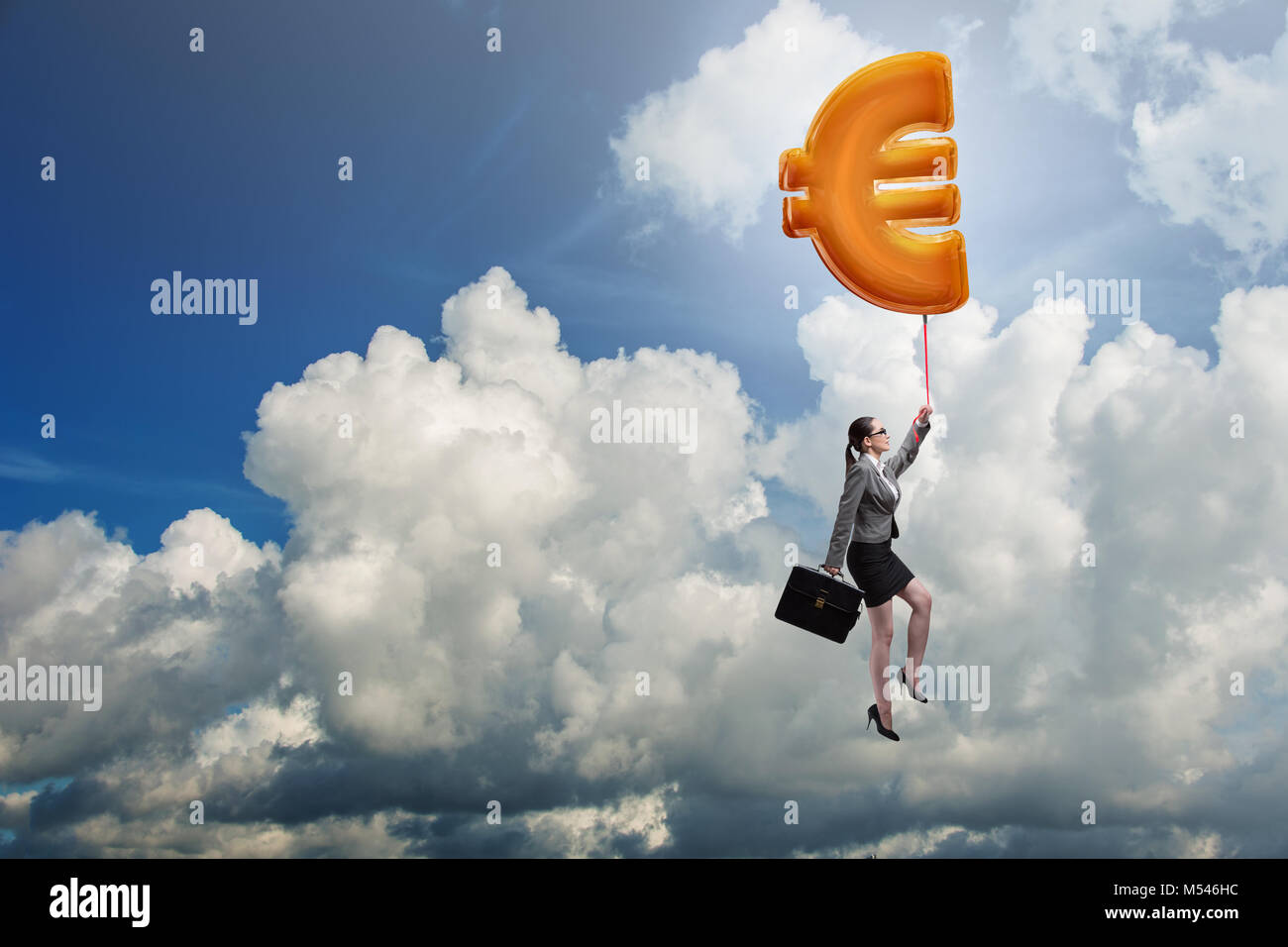 Businesswoman flying on euro sign inflatable balloon Stock Photo - Alamy