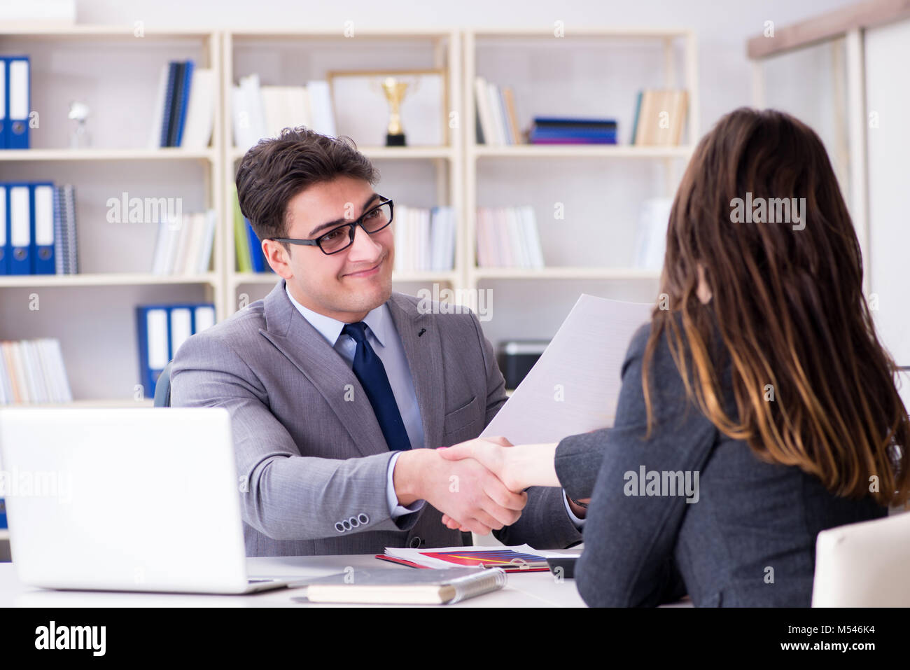 Business meeting between businessman and businesswoman Stock Photo - Alamy
