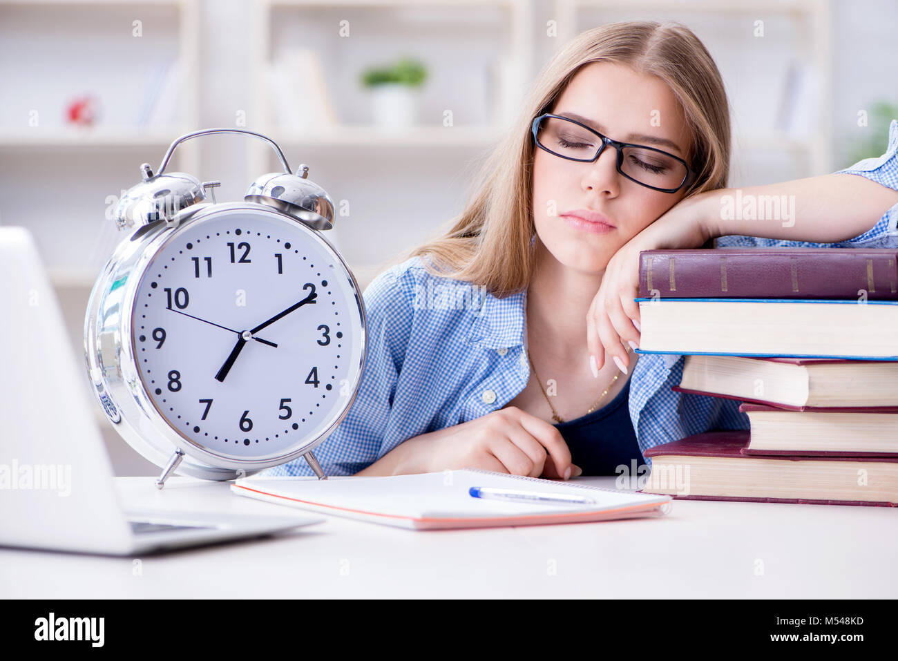 Young teenage female student preparing for exams at home Stock Photo ...