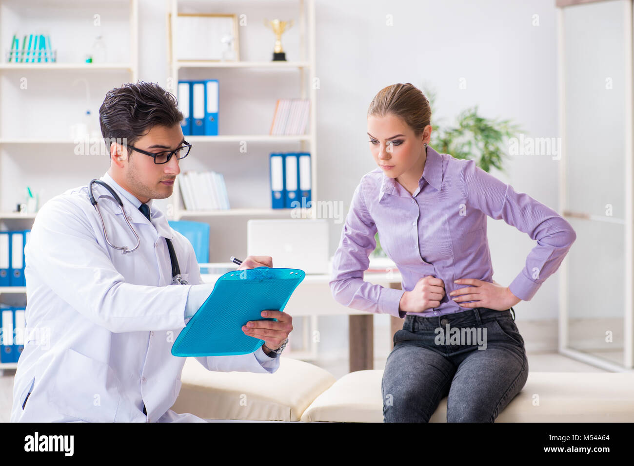 Patient visiting doctor for medical check-up in hospital Stock Photo ...
