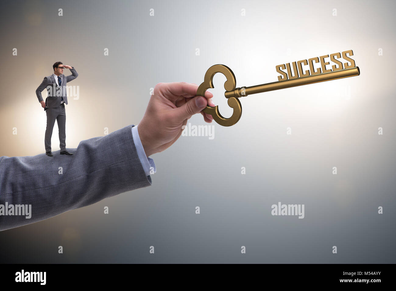 Businessman with key to success business concept Stock Photo - Alamy