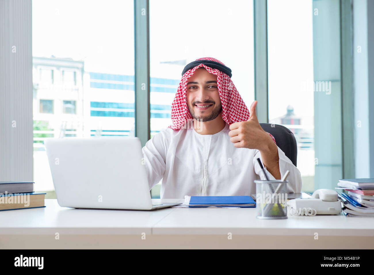 Arab businessman working in the office Stock Photo - Alamy