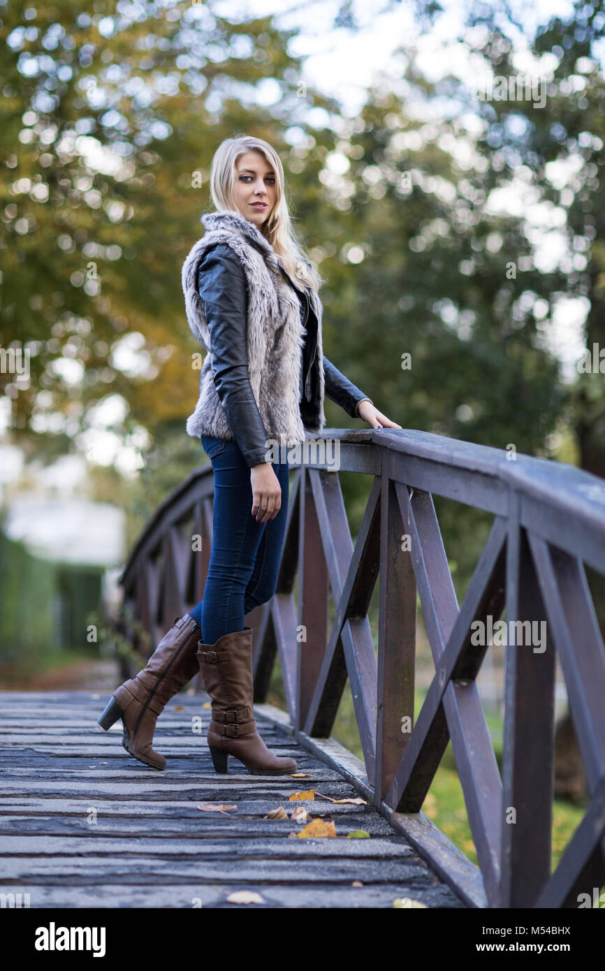 Young blond woman in autumnal outfit Stock Photo